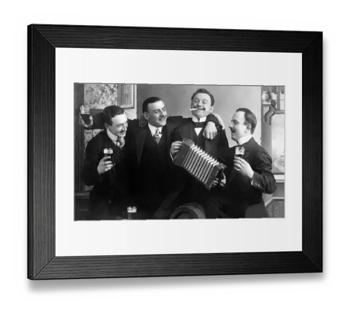 Framed Print : Men drinking beer and playing the accordion on a birthday party