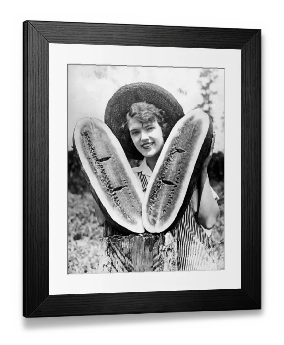 Framed Print : Historic photograph, woman holding a large melon