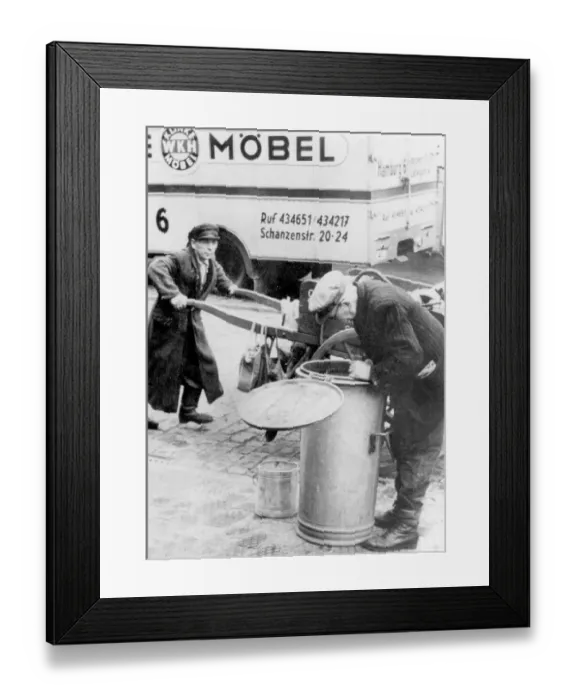 Framed Print : Historic photograph, man sifting through a garbage can Framed Print : Historic photograph, man sifting through a garbage can