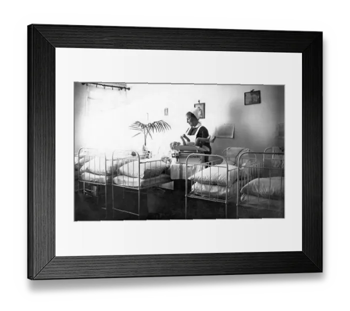 Framed Print : Historical photo, nurse and baby in the hospital Framed Print : Historical photo, nurse and baby in the hospital