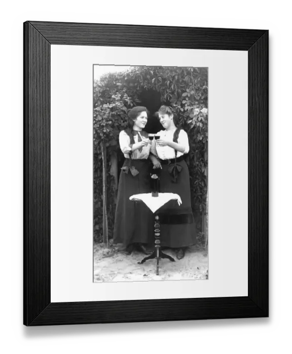 Framed Print : Historic photo, two female friends celebrating with wine Framed Print : Historic photo, two female friends celebrating with wine