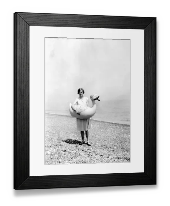Framed Print : Historic photo, woman at the beach with rubber duck Framed Print : Historic photo, woman at the beach with rubber duck