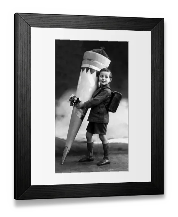 Framed Print : Historic photograph, child carrying a large Schultuete Framed Print : Historic photograph, child carrying a large Schultuete