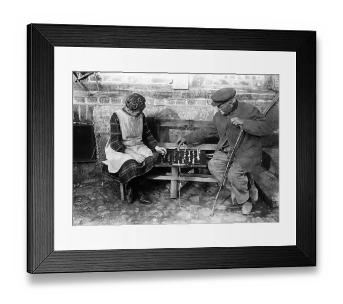 Framed Print : Historic photograph, grandfather playing chess with his granddaughter Framed Print : Historic photograph, grandfather playing chess with his granddaughter