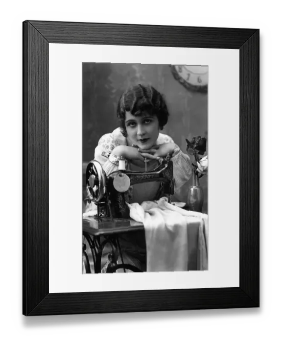 Framed Print : Historic photograph, woman with a sewing machine