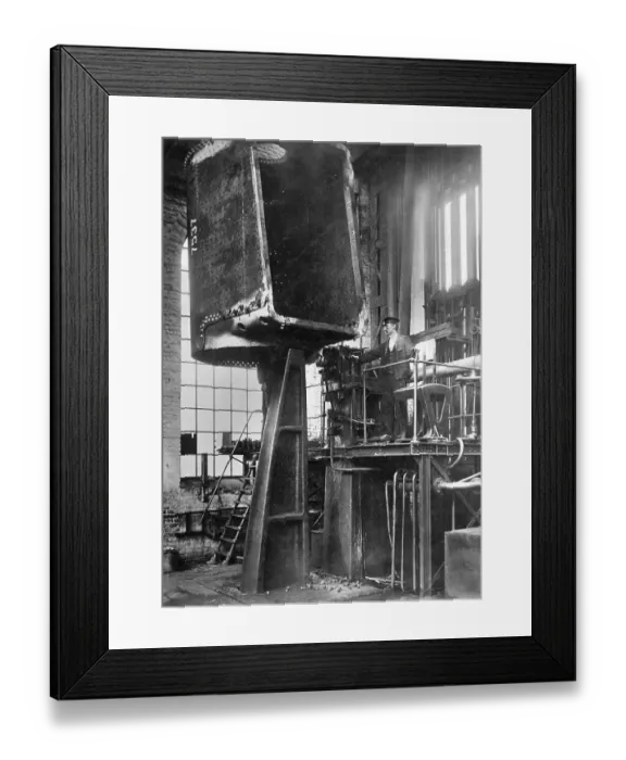 Framed Print : Steam locomotive construction, boiler being riveted with a hydraulic press