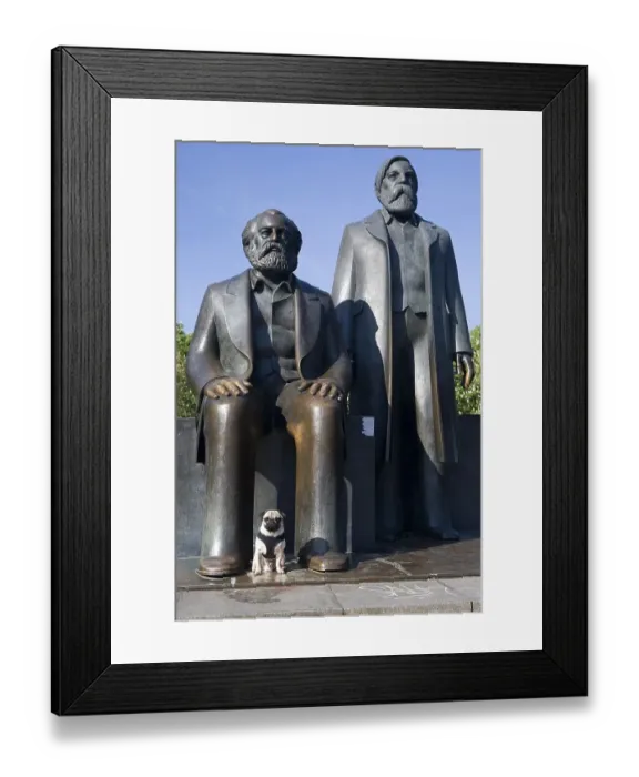 Framed Print : Young pug in front of Marx and Engels monument in Berlin
