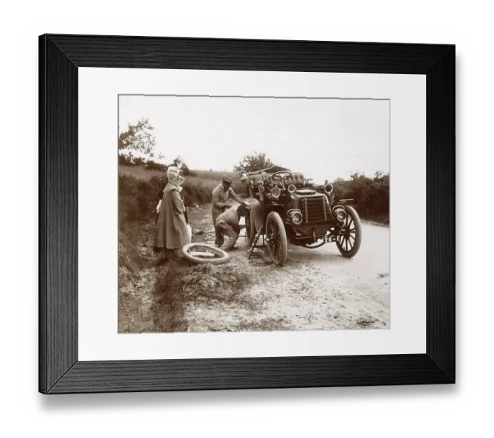 Framed Print : History of the Automobile, changing the tyres of a car on a country road Framed Print : History of the Automobile, changing the tyres of a car on a country road