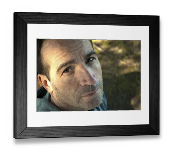 Framed Print : High angle view portrait of an adult man looking at the camera Framed Print : High angle view portrait of an adult man looking at the camera