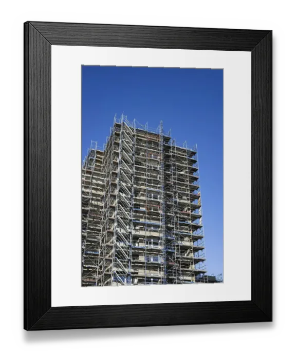 Framed Print : Scaffolded high-rise residential building with balconies and satellite dishes