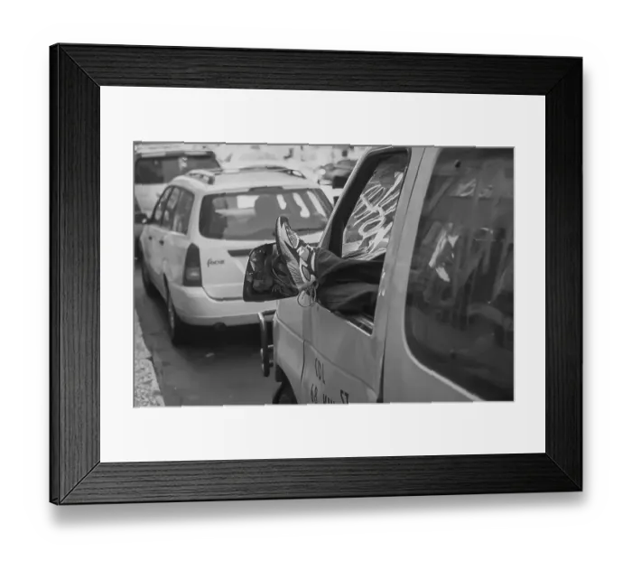 Framed Print : Resting motorist hangs his feet out of car window Framed Print : Resting motorist hangs his feet out of car window