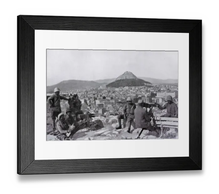 Framed Print : Greek soldiers stationed on the Acropolis with a canon and a machine gun in front of the Lycabettus mount