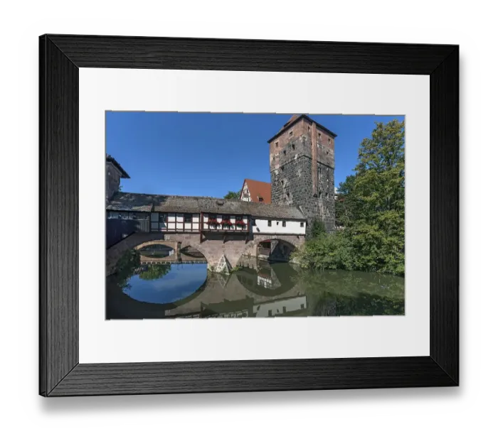 Framed Print : Medieval hangmans bridge and former water tower with reflection in the Pegnitz Framed Print : Medieval hangmans bridge and former water tower with reflection in the Pegnitz