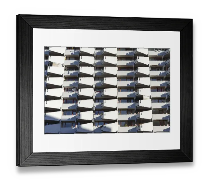 Framed Print : High-rise residential building with balconies and satellite dishes