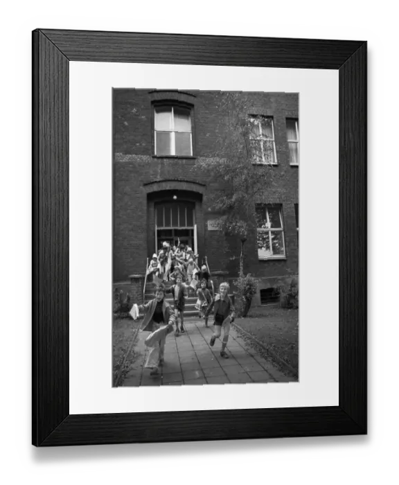 Framed Print : The start of the big holidays and the report cards thrill children at the primary school on 24