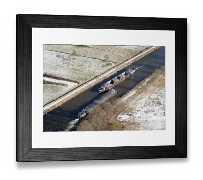 Framed Print : Aerial view of two barges in the Elbe Luebeck Canal in winter Framed Print : Aerial view of two barges in the Elbe Luebeck Canal in winter