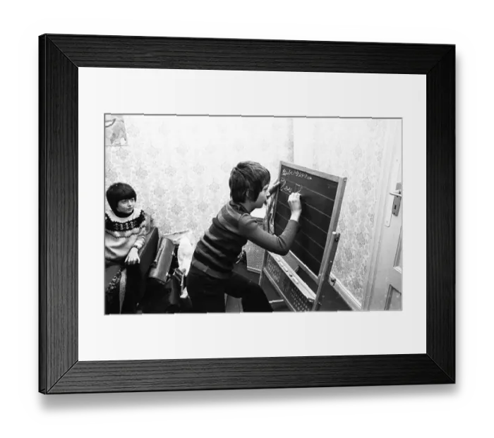 Framed Print : Private tutoring for children with learning difficulties in an afternoon school on 3