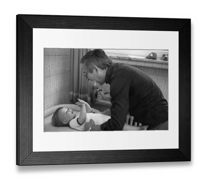 Framed Print : The care of a small child by the father was rather rare in 1980