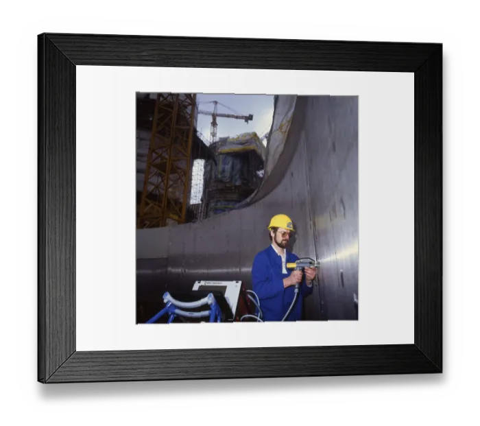 Framed Print : Workmen building a coal-fired power plant Framed Print : Workmen building a coal-fired power plant