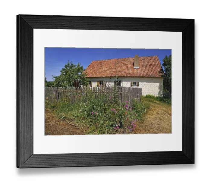 Framed Print : Farmhouse, built in 1711, in front a farm garden with fence Framed Print : Farmhouse, built in 1711, in front a farm garden with fence
