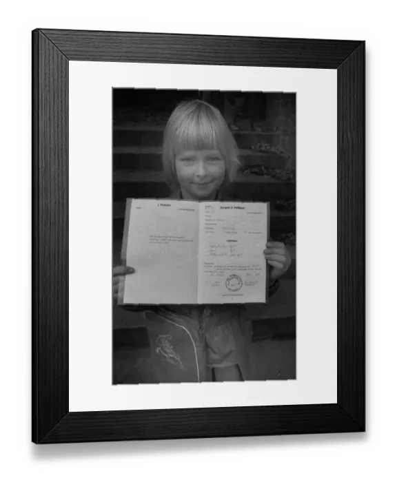 Framed Print : The start of the big holidays and the report cards thrill children at the primary school on 24