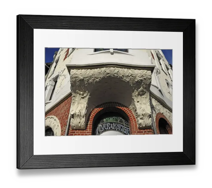 Framed Print : Entrance to a house and underside of a bay window with Art Nouveau elements around 1900