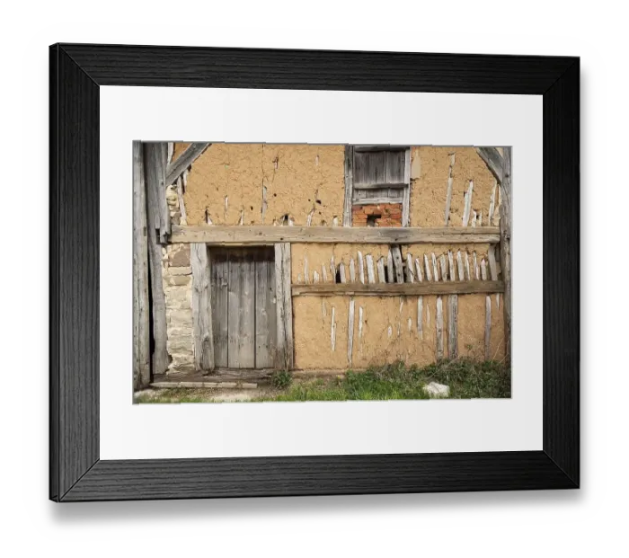 Framed Print : Exposed clay plaster wall of a barn
