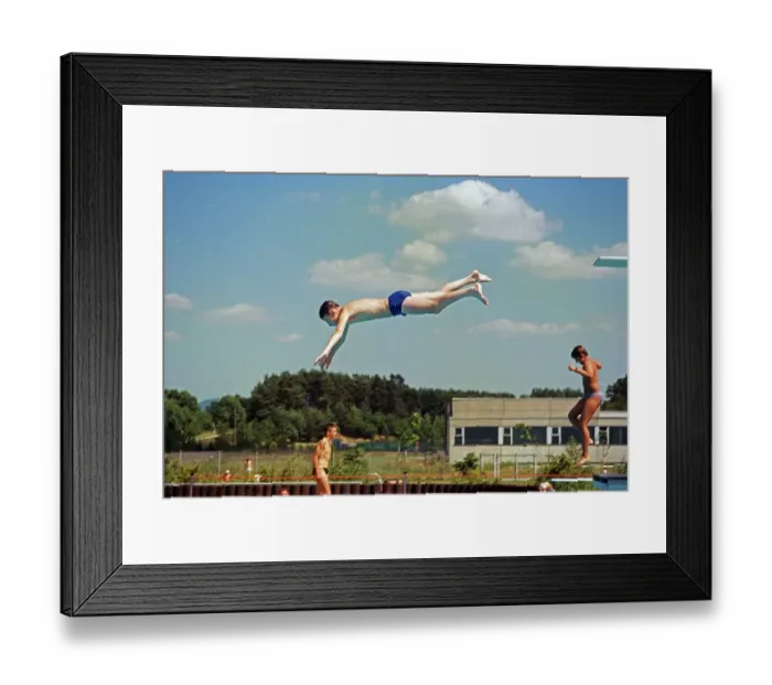 Framed Print : Boy jumping from three-metre board