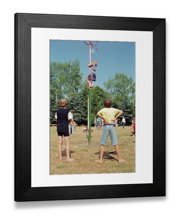 Framed Print : Girl climbing maypole, boys waiting