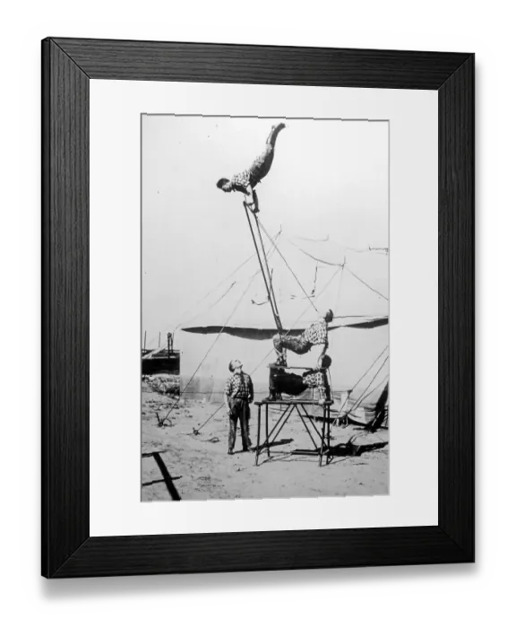 Framed Print : Old archival black and white photograph from the 1920s showing acrobats Framed Print : Old archival black and white photograph from the 1920s showing acrobats