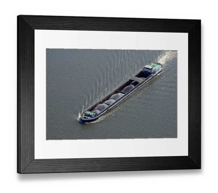 Framed Print : Aerial view of a barge Swabia with bulk material on the Elbe