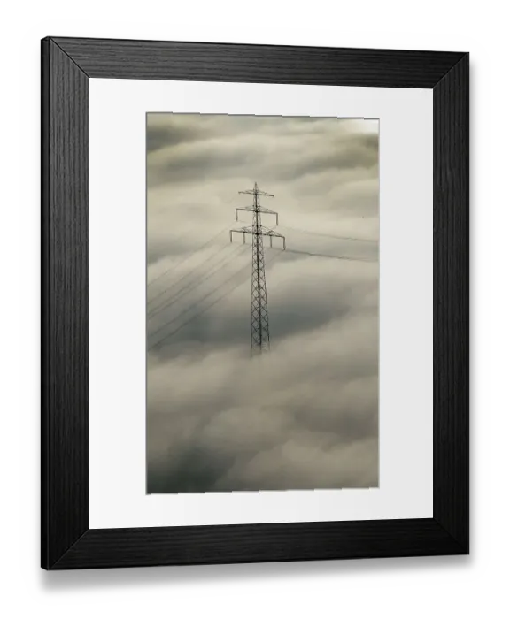 Framed Print : High voltage pylon in fog, aerial view