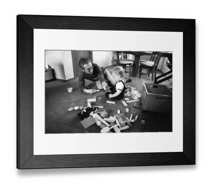 Framed Print : The care of a small child by the father was rather rare in 1980 Framed Print : The care of a small child by the father was rather rare in 1980