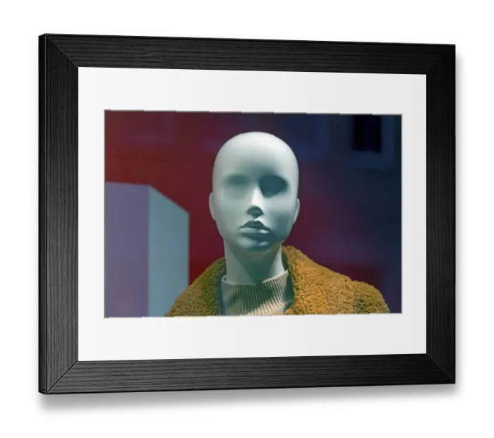 Framed Print : White head of a female mannequin in a fashion shop