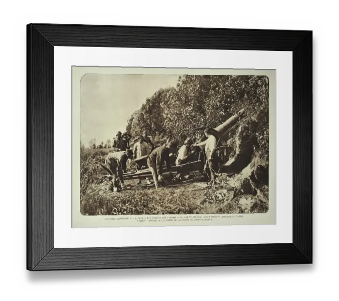 Framed Print : Artillery soldiers firing battery cannon from behind camouflage screen towards battlefield in Flanders during the WWI