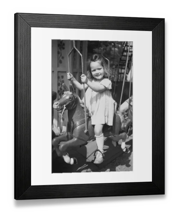 Framed Print : Girl drives carousel, 1949, Leipzig Framed Print : Girl drives carousel, 1949, Leipzig