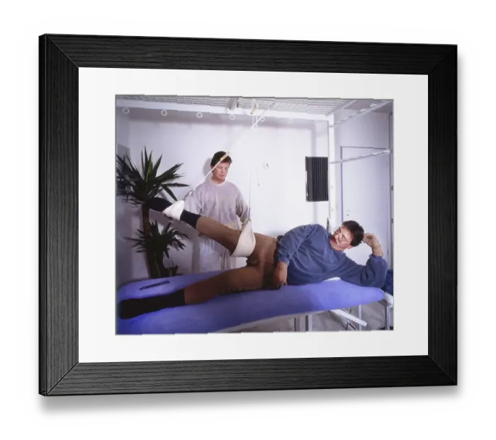 Framed Print : Outpatient physiotherapy with a therapist