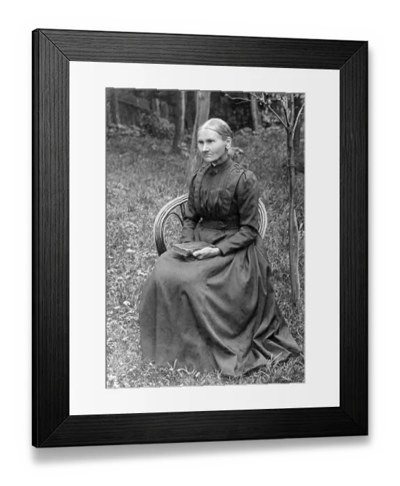 Framed Print : Portrait, old woman sitting on a chair