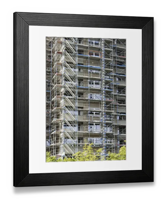 Framed Print : Scaffolded high-rise residential building with balconies and satellite dishes