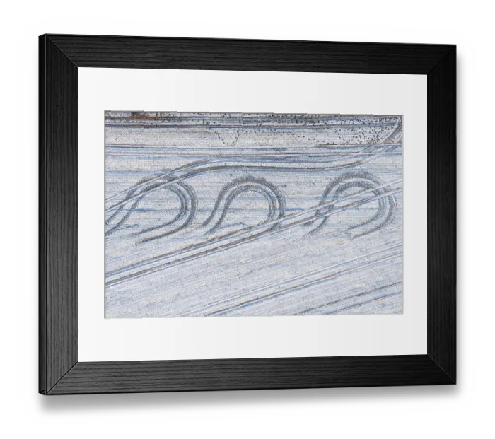 Framed Print : Aerial view tractor tracks on a snowy field Framed Print : Aerial view tractor tracks on a snowy field