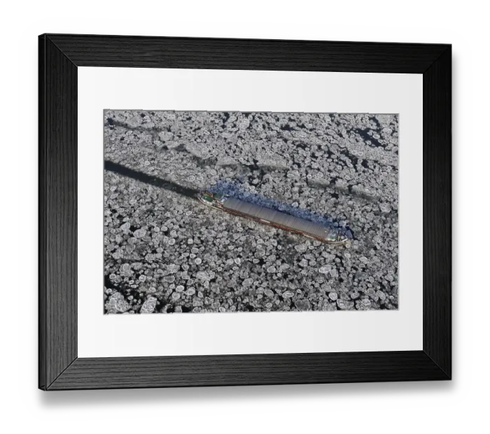 Framed Print : Aerial view of a barge during ice conditions on the Elbe