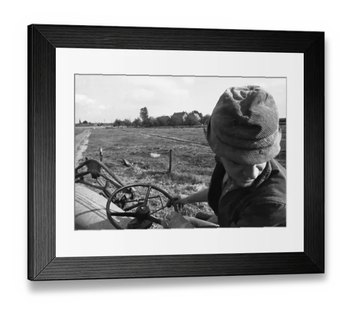 Framed Print : Farmers working in the fields in Muensterland on 10