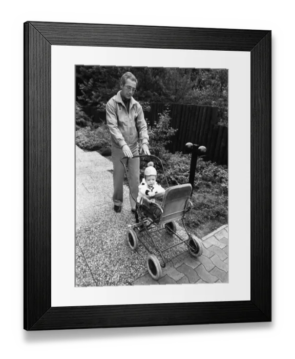 Framed Print : The care of a small child by the father was rather rare in 1980