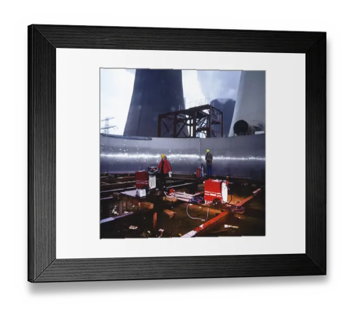 Framed Print : Workmen building a coal-fired power plant