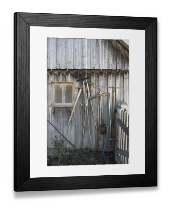 Framed Print : Agriculture implements on a barn