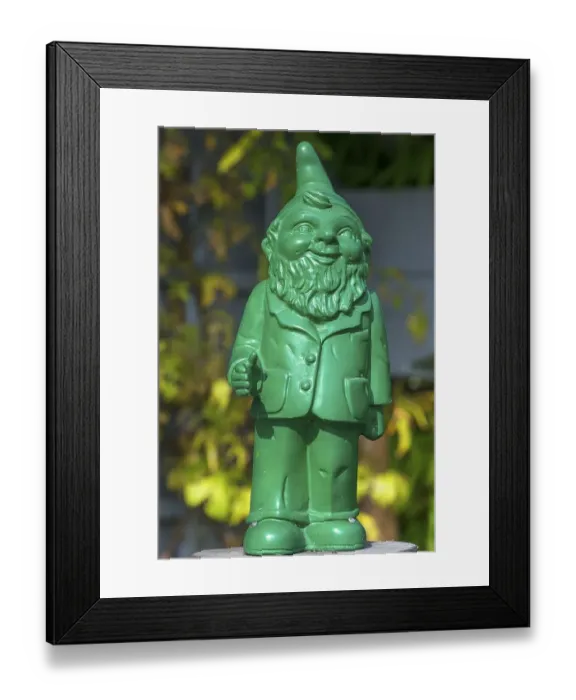 Framed Print : Green garden gnome designed by the artist Ottmar Horl