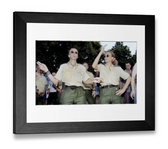 Framed Print : Policewomen of the Berlin police celebrate with techno fans during the Love Parade