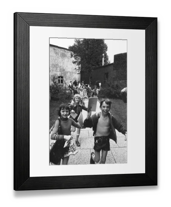 Framed Print : The start of the big holidays and the report cards thrill children at the primary school on 24