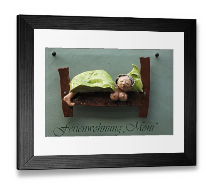 Framed Print : Ceramic figure on a holiday home Framed Print : Ceramic figure on a holiday home