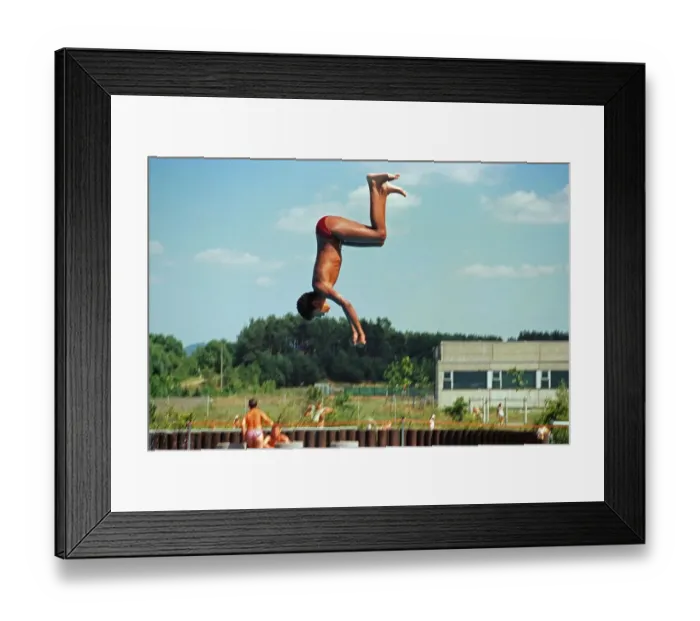 Framed Print : Boy jumping from three-metre board